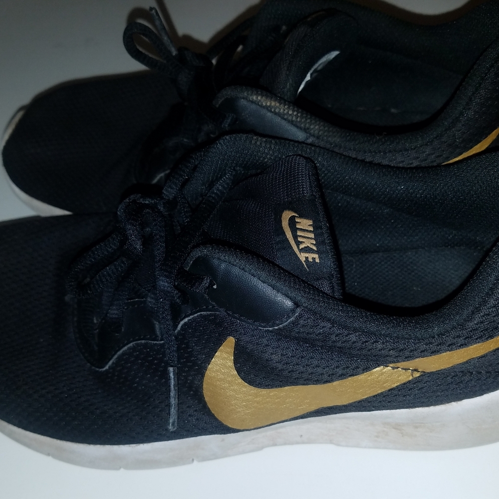 Nike 6.5Y. Black, Gold and White Soles.